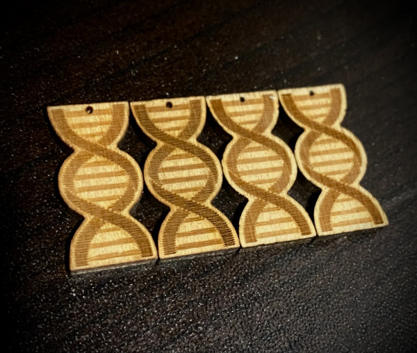 Four laser cut DNA Helices on 1/8 wood