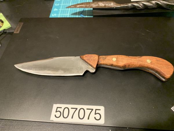 4 inch blade, custom carved wooden handle.