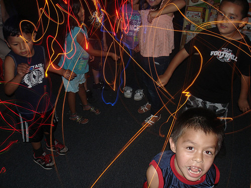 Kids playing with LED lights